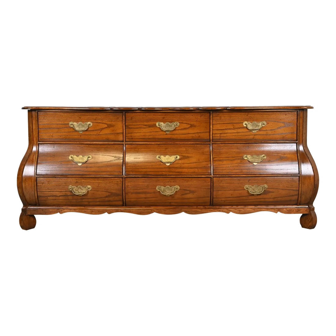 Baker Furniture French Provincial Louis XV Oak and Burl Wood Bombay Form Triple Dresser, Circa 1960s: A gorgeous French Provincial Louis XV style bombay form triple dresser or credenza By Baker Furniture, "Milling Road" Collection USA, Circa 1960s Carved solid oak, with burl wood top and original bras