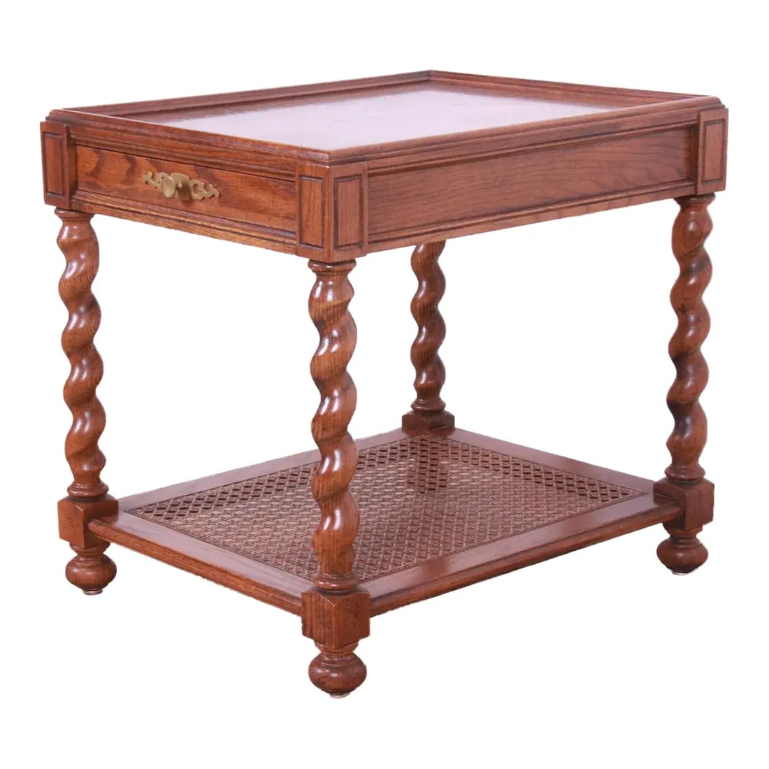 1970s Baker Furniture English Barley Twist Oak, Burl - and Cane Tea Table: A gorgeous Jacobean style English barley twist tea table or occasional side table By Baker Furniture USA, Circa 1970s Carved oak, with caned lower shelf and original brass hardware. Measures: 21"W x 2