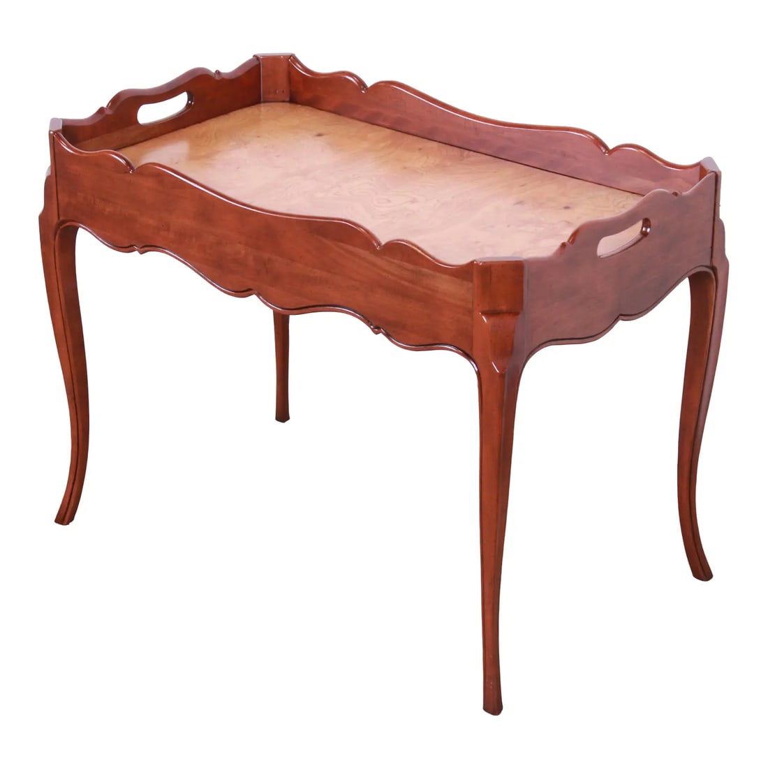 Baker Furniture French Provincial Cherry and Burl Wood Butler Coffee Table: An exceptional French Provincial style butler coffee or tea table By Baker Furniture USA, Circa 1960s Carved solid cherry, with burled olive wood top. Measures: 30.5"W x 18"D x 22.75"H. Newly refinish