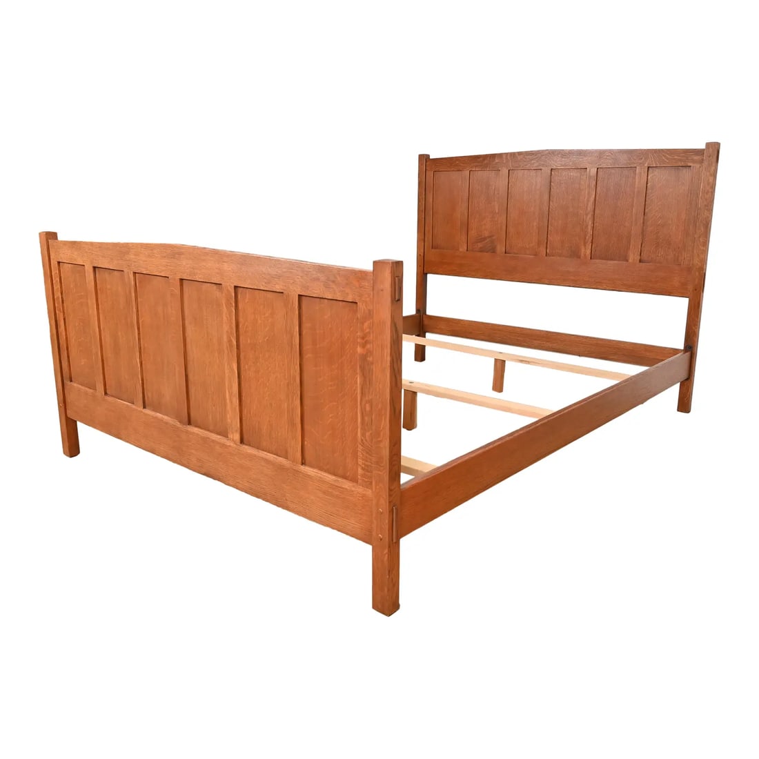 Stickley Mission Oak Arts & Crafts Queen Size Bed: An exceptional Mission or Arts & Crafts style solid oak queen size bed frame By L. & J.G. Stickley USA, Circa Late 20th Century Measures: 63.5"W x 85"D x 47.5"H. Very good original vintage condition.