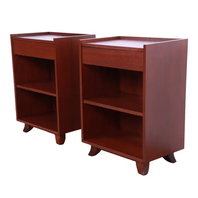 Gilbert Rohde for Herman Miller Art Deco Mahogany Nightstands, Newly Refinished: A gorgeous pair of Art Deco or mid-century modern mahogany nightstands By Gilbert Rohde for Herman Miller USA, 1930s Measures: 18"W x 12"D x 25.5"H. Newly refinished. Very good condition.