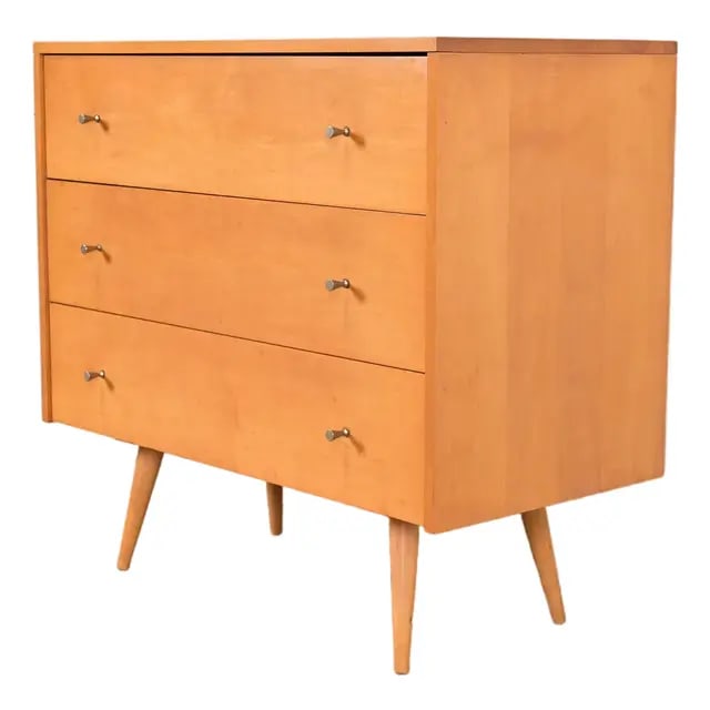 Paul McCobb Planner Group Mid-Century Modern Solid Birch Three-Drawer Dresser, 1950s: An iconic Mid-Century Modern three-drawer dresser or chest of drawers By Paul McCobb for Winchendon Furniture, "Planner Group" USA, 1950s Solid birch, with original brass hardware. Measures: 36"W x 18