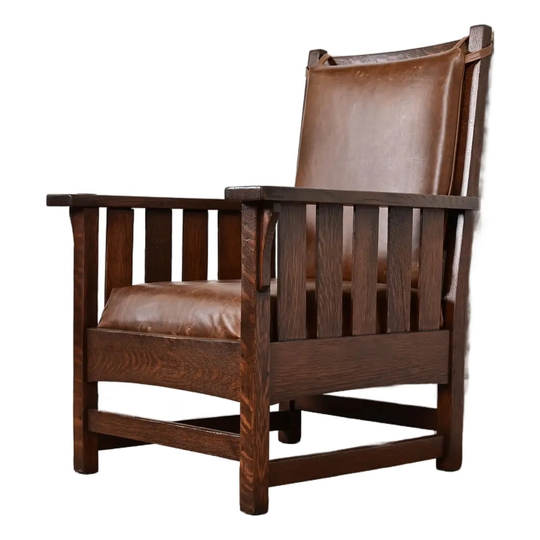 Charles Stickley Antique Mission Oak Arts & Crafts Lounge Chair, Newly Refinished: A gorgeous antique Mission or Arts & Crafts period lounge chairBy Charles StickleyUSA, Circa 1910Solid quarter sawn oak frame, with brown leather upholstered seat and back cushions.Measures: 30"W x
