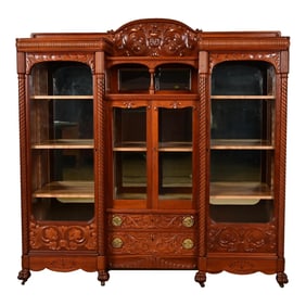 R. J. Horner Style Antique Victorian Carved Cherry Wood Triple Bookcase, Circa 1880s