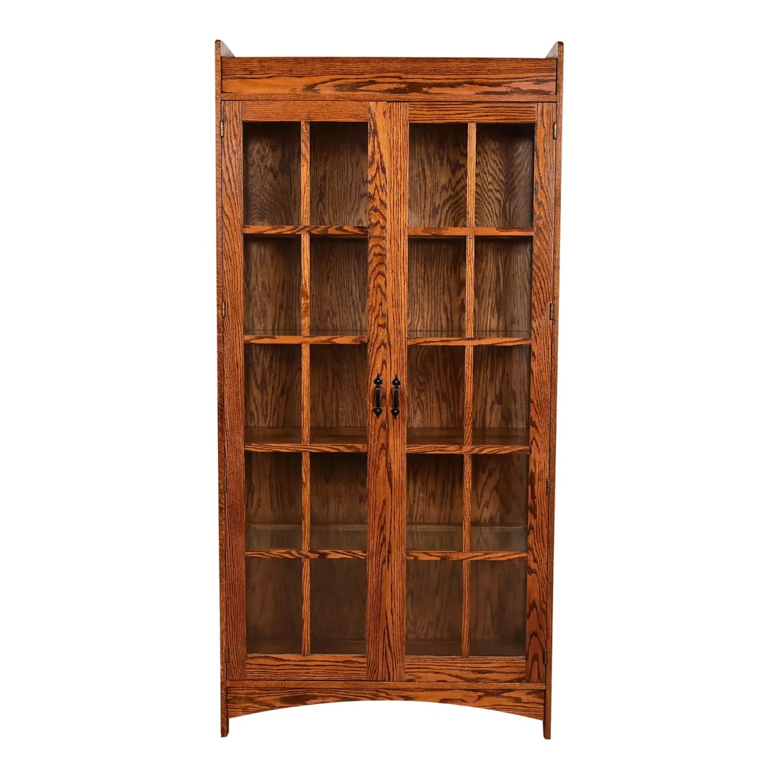 Gustav Stickley Style Mission Oak Arts and Crafts Lighted Bookcase Cabinet: A beautiful Mission or Arts & Crafts style lighted bookcase or display cabinetIn the manner of Gustav StickleyUSA, Circa Late 20th CenturyOak, with mullioned glass front doors and sides.Measures: