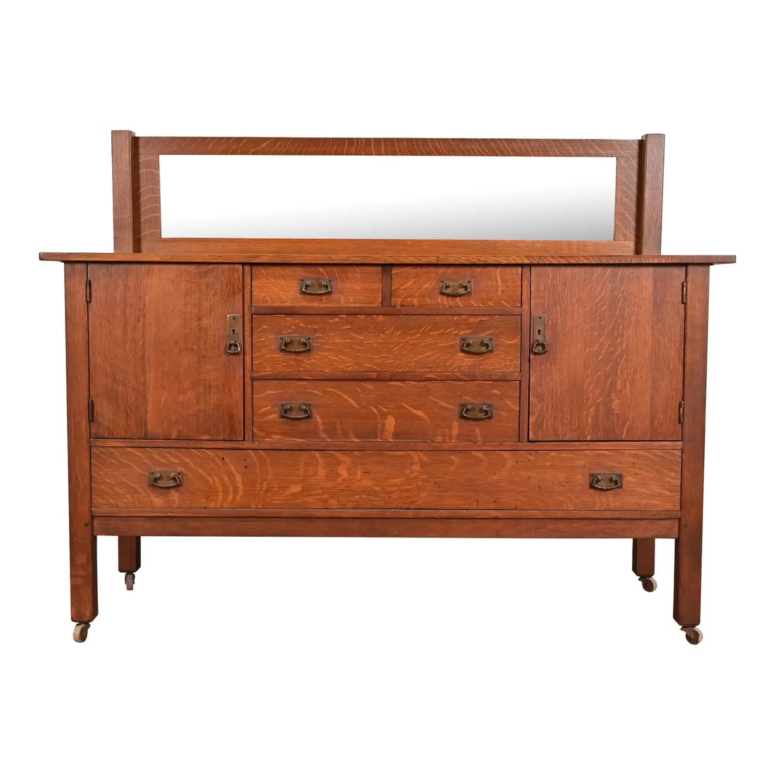 L. & J. G. Stickley Antique Mission Oak Arts & Crafts Sideboard, Circa 1910: An exceptional Mission or Arts & Crafts period sideboard, credenza, buffet server, or bar cabinet By L. & J.G. Stickley USA, Circa 1910 Quarter sawn oak, with mirrored backsplash, and original hammere