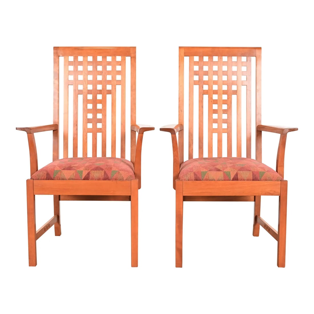 Stickley Mission Arts & Crafts Cherry Wood Armchairs in the Manner of Frank Lloyd Wright, Pair: An exceptional pair of Mission or Arts & Crafts style armchairs or dining captain chairs In the manner of Frank Lloyd Wright By L. & J.G. Stickley USA, 2006 Solid cherry wood frames, with upholstered