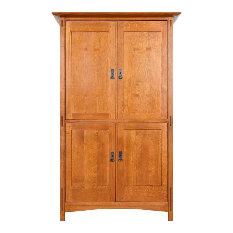 Stickley Mission Oak Arts & Crafts Media Armoire Cabinet: An exceptional Mission or Arts & Crafts style media cabinet or armoireBy L. & J.G. StickleyUSA, Circa Late 20th CenturySolid quarter sawn oak, with hammered copper hardware.Measures: 48"W x 24.25"D x