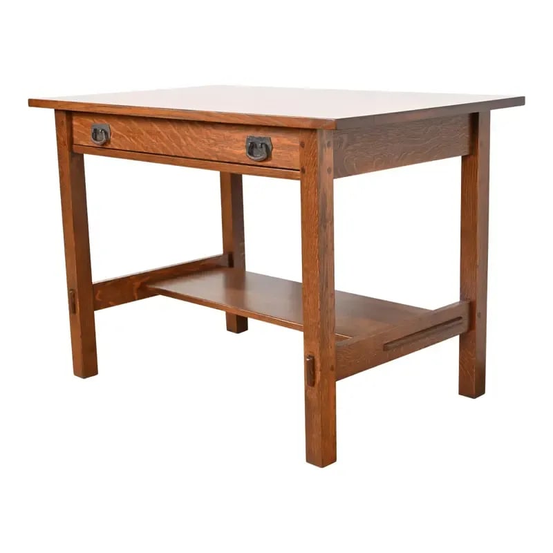 Gustav Stickley Mission Oak Arts & Crafts Writing Desk or Library Table, Newly Restored: An exceptional antique Mission or Arts & Crafts writing desk or library tableBy Gustav StickleyUSA, Circa 1900Solid quarter sawn oak, with original hammered copper hardware.Measures: 42"W x 26"D x