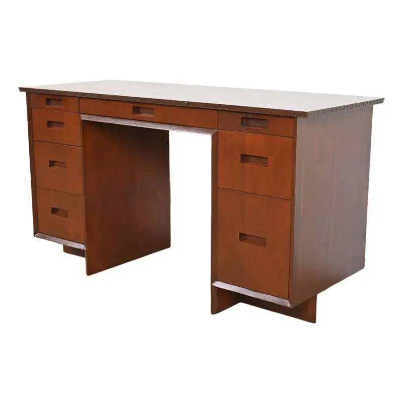 Frank Lloyd Wright Taliesin Mahogany Double Pedestal Desk, Newly Refinished: A very rare and exceptional Mid-Century Modern "Taliesin" writing deskBy Frank Lloyd Wright for Heritage HenredonUSA, 1950sMahogany, with iconic carved geometric Taliesin detailing.Measures: 52"W x