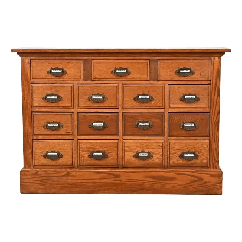 Antique Arts & Crafts Oak 15-Drawer Filing Cabinet or Apothecary Cabinet, Circa 1900: A rare and exceptional antique Arts & Crafts 15-drawer card catalog, file cabinet, or apothecary cabinet USA, Early 20th Century Oak, with original iron hardware. Measures: 52.63"W x 12.88"D x 36"H. V