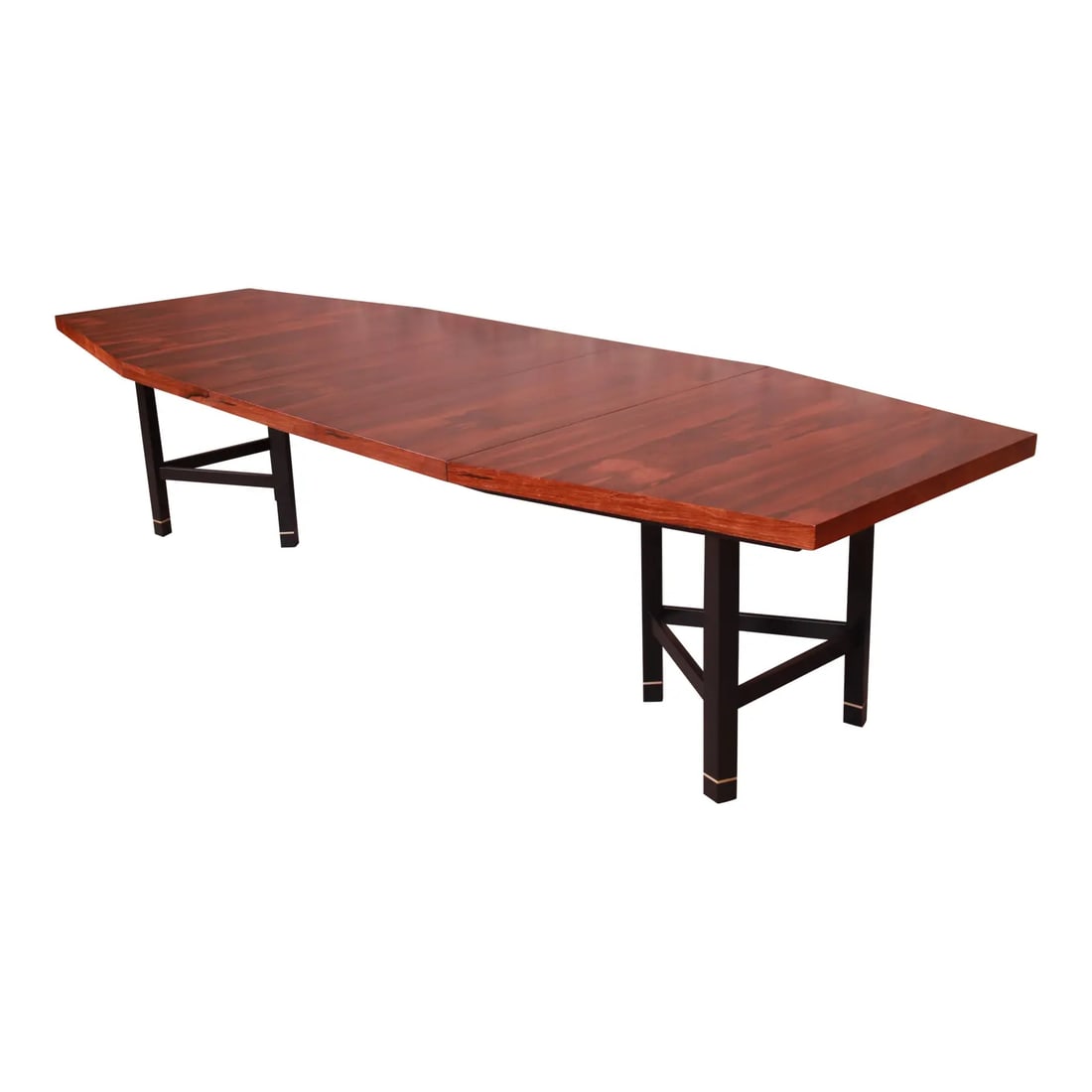 Harvey Probber Brazilian Rosewood Boat-Shaped Extension Dining Table, Newly Restored: An exceptional mid-century modern boat-shaped extension dining table By Harvey Probber USA, Circa 1950s Book-matched Brazilian rosewood, with ebonized solid mahogany legs and brass accents. Measures: