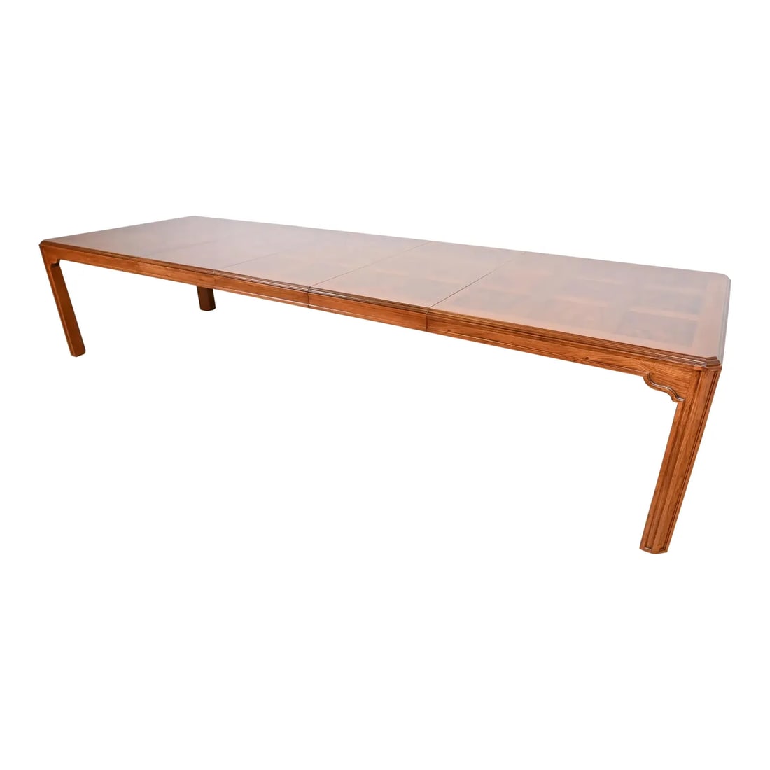 Drexel Heritage Mid-Century Hollywood Regency Oak and Burl Wood Extension Dining Table: A gorgeous mid-century modern Hollywood Regency extension dining tableBy Drexel HeritageUSA, Circa 1960sOak, with inlaid burl wood parquet top.Measures: 75.5"W x 45.5"D x 29"H. Extends up to 141.5"W