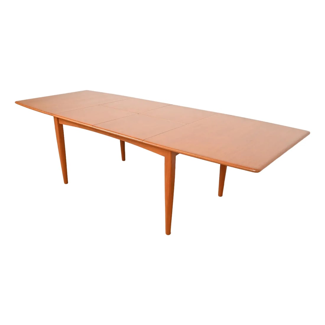 Falster Danish Modern Teak Boat-Shaped Extension Dining Table, Newly Refinished: An exceptional Danish Modern teak boat-shaped extension dining tableBy Falster MøbelfabrikDenmark, 1960sMeasures: 61.5"W x 40"D x 29.25"H. Extends up to 103"W with two built-in 20.75"