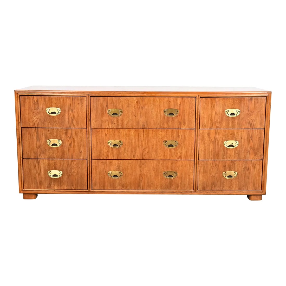 Drexel Heritage Hollywood Regency Campaign Oak Triple Dresser or Credenza: A gorgeous mid-century modern Hollywood Regency Campaign style nine-drawer dresser or credenzaBy Drexel Heritage USA, Circa 1980sOak, with original brass hardware.Measures: 65.75"W x 19"D x