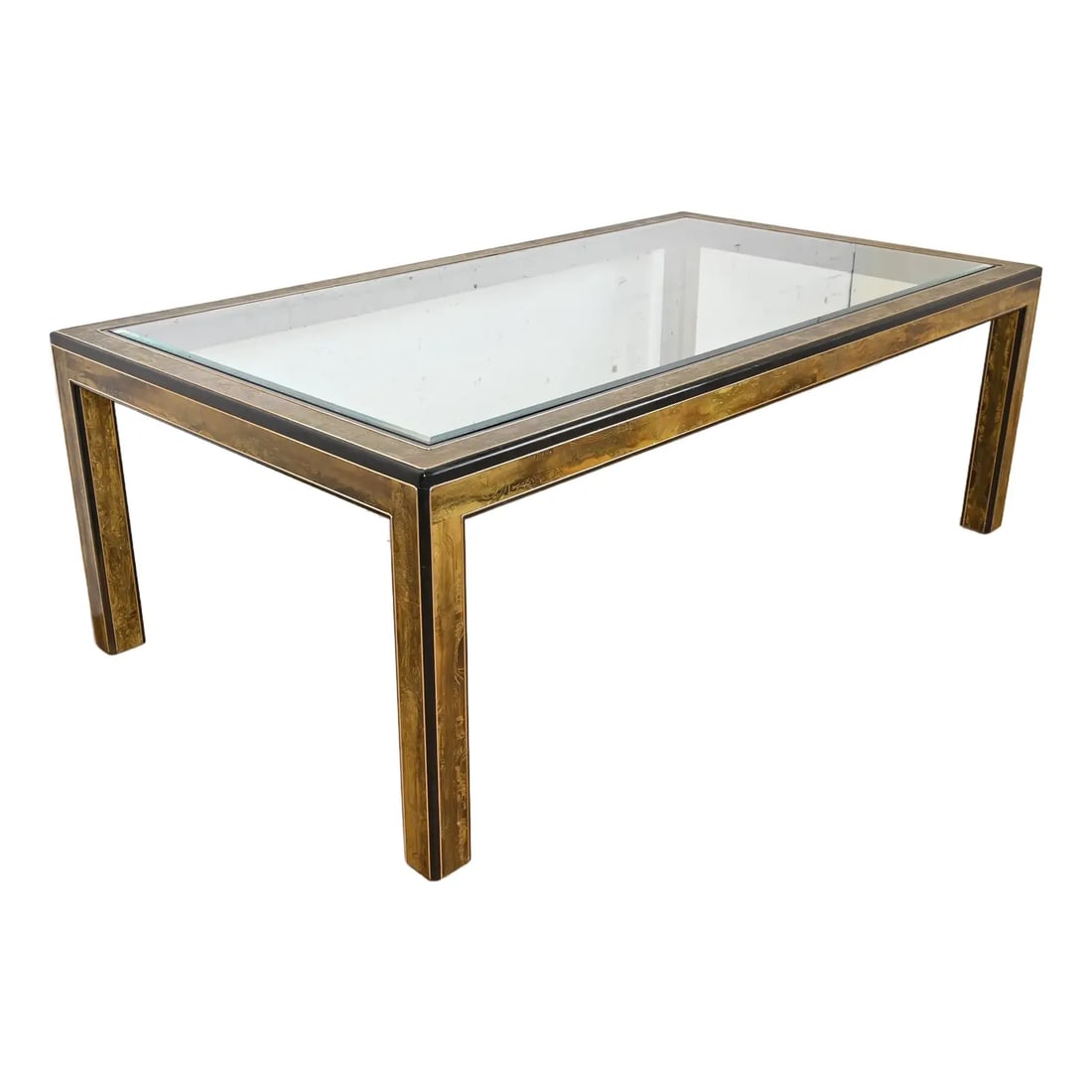 Bernhard Rohne for Mastercraft Hollywood Regency Acid Etched Brass Dining Table, 1970s: A gorgeous mid-century modern Hollywood Regency dining tableBy Bernhard Rohne for Mastercraft FurnitureUSA, 1970sAcid etched brass, with ebonized wood, and beveled glass top.Measures: 84"W x 47"D x