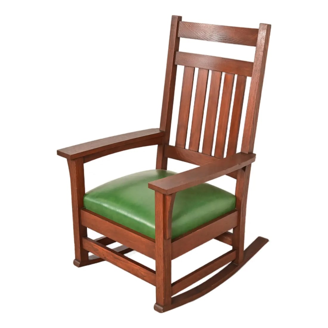 Stickley Brothers Style Antique Mission Oak Arts & Crafts Rocking Chair, Circa 1900: A gorgeous antique Mission or Arts & Crafts period rocking chair In the manner of Stickley Brothers USA, Early 20th Century Solid quarter sawn oak, with green vinyl upholstered seat cushion. Measures: