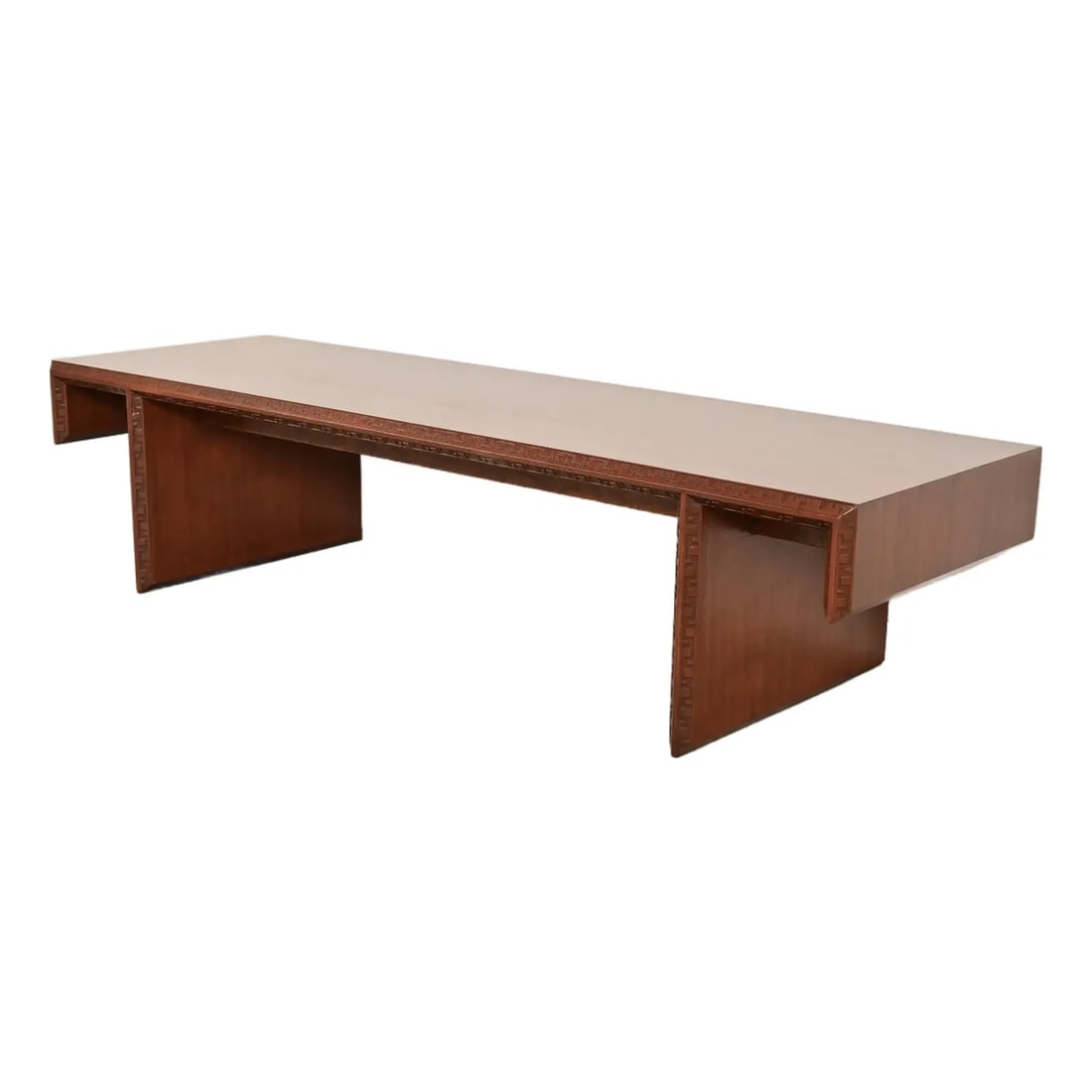 Frank Lloyd Wright Taliesin Carved Mahogany Coffee Table or Bench, Newly Restored: A rare and exceptional Mid-Century Modern "Taliesin" coffee table or bench By Frank Lloyd Wright for Heritage Henredon USA, 1955 Mahogany, with iconic carved geometric Taliesin detailing. Measures: 60