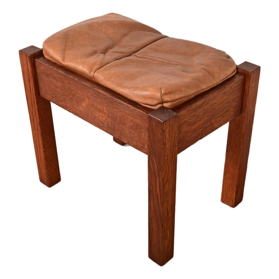 Stickley Antique Mission Oak Arts & Crafts Upholstered Footstool or Ottoman: A gorgeous antique Mission or Arts & Crafts period footstool or ottoman By Stickley Brothers USA, Early 20th Century Solid oak, with leather upholstery. Measures: 17.25"W x 12"D x 16.5"H. Very good vi