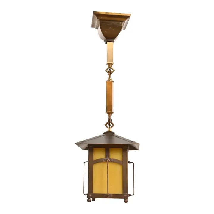Roycroft Antique Arts & Crafts Brass and Caramel Glass Lantern Pendant Light, Circa 1920s: A rare and exceptional antique Arts & Crafts period brass and caramel glass lantern pendant light By Roycroft (signed with impressed orb and cross mark) USA, Circa 1920s Measures: 7"W x 7"D x 22"H. La