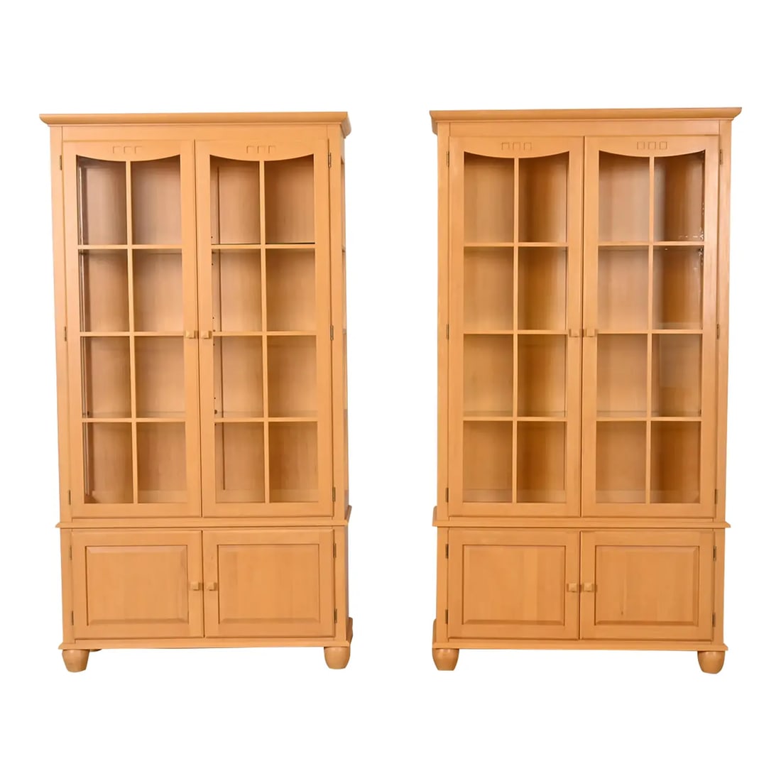 Ethan Allen Arts & Crafts Shaker Maple Lighted Bookcase Cabinets, Pair: A gorgeous pair of Arts & Crafts or Shaker style lighted bookcases or display cabinets By Ethan Allen USA, Late 20th Century Carved maple, with mullioned glass front doors and sides. Interior shelves
