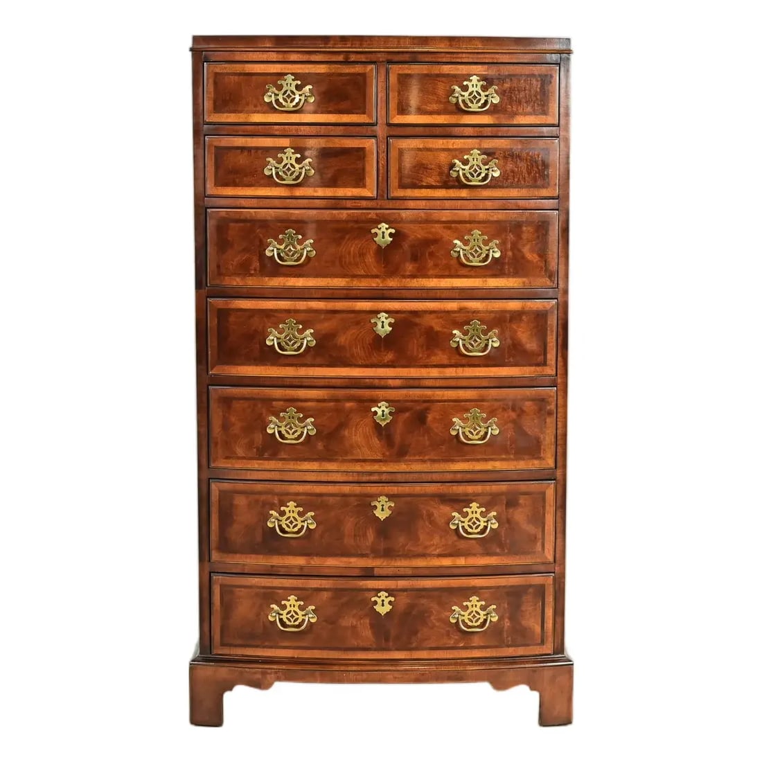 Henredon Georgian Mahogany and Burl Wood Highboy Dresser: An exceptional Georgian or Chippendale style nine-drawer bow front highboy dresser By Henredon, "Aston Court" Collection USA, Circa 1980s Beautiful mahogany and burl wood, with original brass hardware