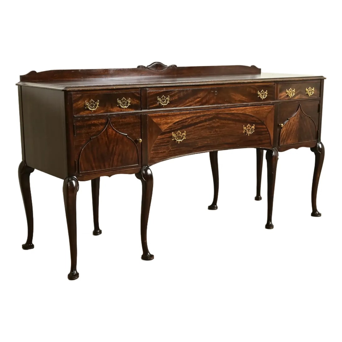 Limbert Antique Queen Anne Carved Mahogany Sideboard or Bar Cabinet, Circa 1920s: An exceptional antique Chippendale or Queen Anne style sideboard, buffet server, console, or bar cabinet By Charles P. Limbert Co. USA, Circa 1920s Gorgeous carved mahogany, with original brass hardwa