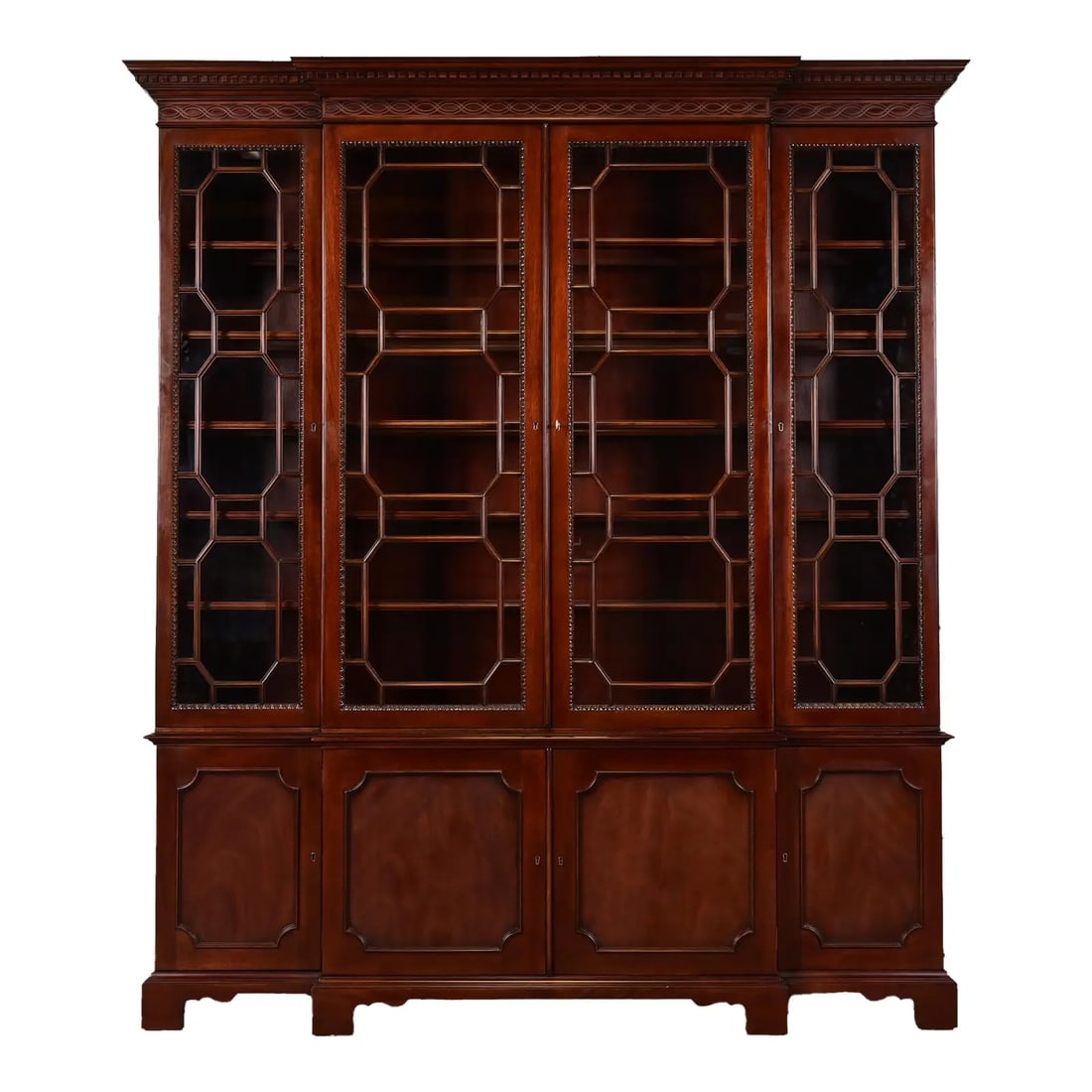 Late 20th Century Kindel Furniture Georgian Carved Mahogany Lighted Breakfront Bookcase Cabinet: An outstanding Georgian or Chippendale style lighted breakfront bookcase cabinet or dining cabinet By Kindel Furniture USA, Late 20th century Gorgeous carved mahogany, with mullioned glass front doors