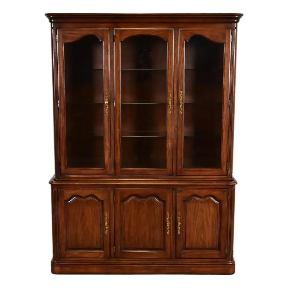 1980sKindel Furniture French Louis Philippe Lighted Breakfront Bookcase Cabinet: A gorgeous French Louis Philippe style lighted breakfront bookcase or dining cabinet By Kindel Furniture USA, Circa 1980s Solid walnut, with glass front doors and original brass hardware. Shelves are