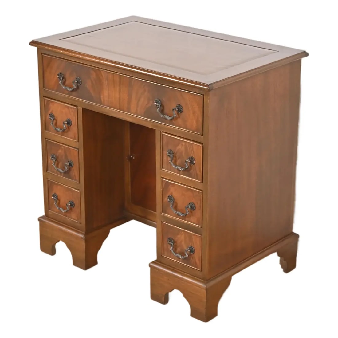 Baker Furniture Style Georgian Flame Mahogany Writing Desk, Circa 1940s: A gorgeous Georgian or Chippendale style petite writing desk In the manner of Baker Furniture USA, Circa 1940s Carved mahogany, with beautiful book-matched flame mahogany drawer fronts, and original b