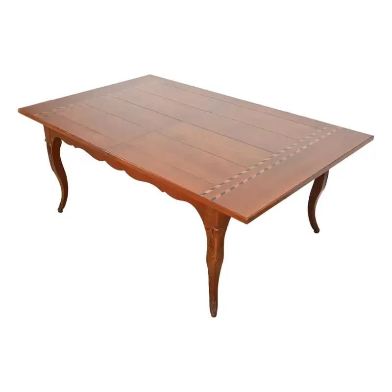 Baker Furniture Italian Provincial Inlaid Cherry Wood Harvest Farm Table: An exceptional Italian Provincial or French Country extension harvest dining table By Baker Furniture USA, Late 20th Century Solid cherry wood, with satinwood and ebony inlay. Measures: 76.25"W x 46.5