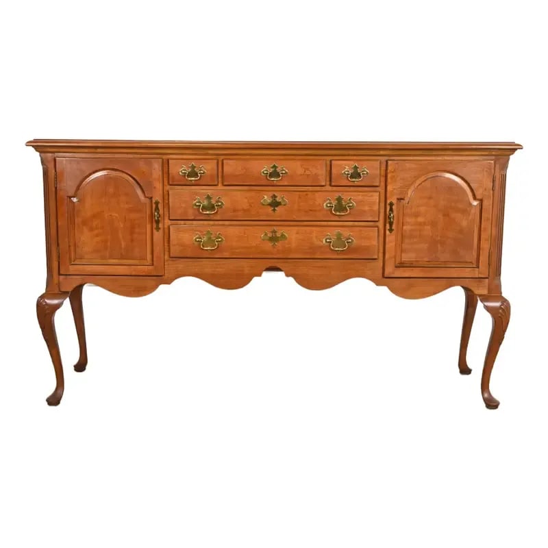 Henredon Queen Anne Solid Cherry Wood Sideboard Credenza: An exceptional Queen Anne or Chippendale style sideboard buffet, credenza, or console table By Henredon USA, Circa 1980s Solid carved cherry wood, with original brass hardware. Measures: 67"W x 19"D x