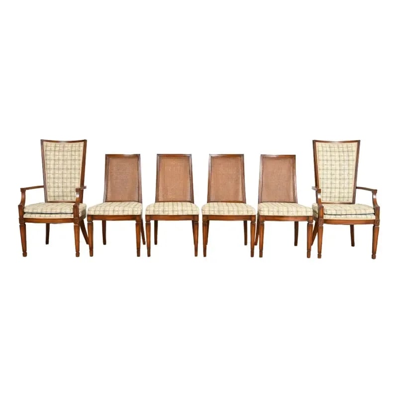 Henredon Style French Regency Louis XVI Carved Walnut and Cane Back Dining Chairs, Set of Six: A gorgeous set of six French Regency Louis XVI style dining chairs In the manner of Henredon By Grand Ledge Chair Company USA, Circa 1960s Carved solid walnut frames, with caned backs and upholstered