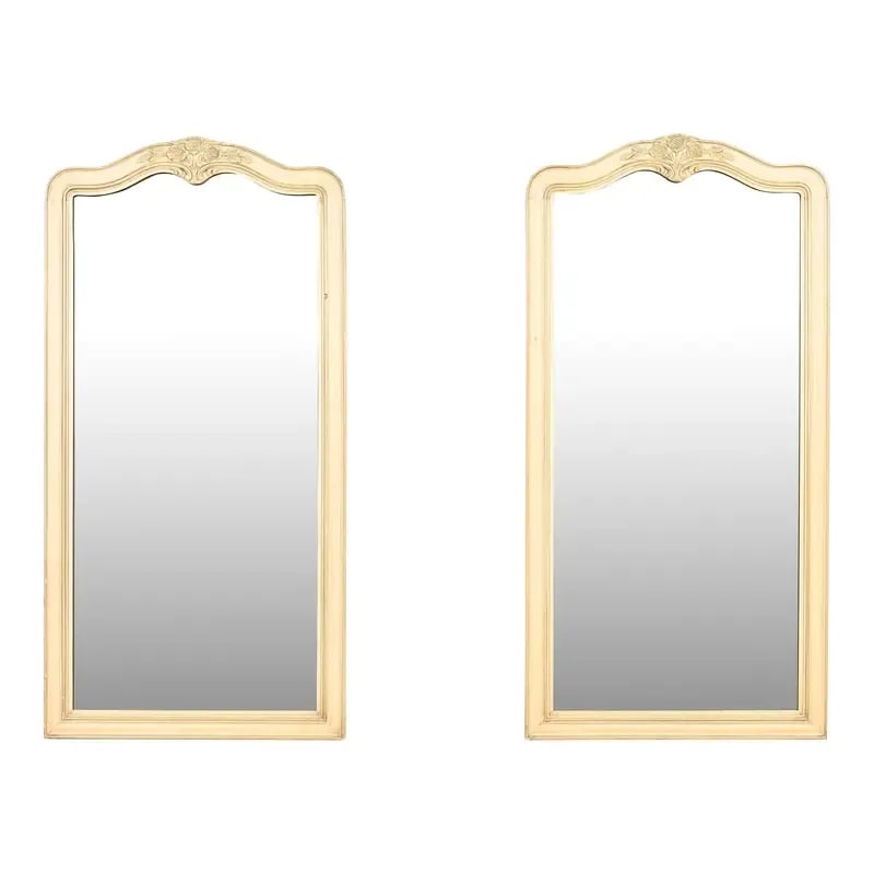 Henredon French Provincial Louis XV Cream and Light Green Lacquered Tall Wall Mirrors, Pair: A stylish pair of French Provincial Louis XV style tall wall mirrors By Henredon USA, Circa 1960s Carved cream lacquered walnut, with olive green trim. Measures: 23.13"W x 1.38"D x 46.38"H. Good origi