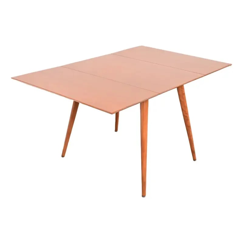 Paul McCobb Planner Group Solid Maple Drop Leaf Dining Table, Newly Refinished: A sleek and stylish Mid-Century Modern solid maple drop-leaf dining table By Paul McCobb for Winchendon Furniture, "Planner Group" USA, 1950s Measures: 56"W x 36"D x 29"H. With leaves down, width is 2