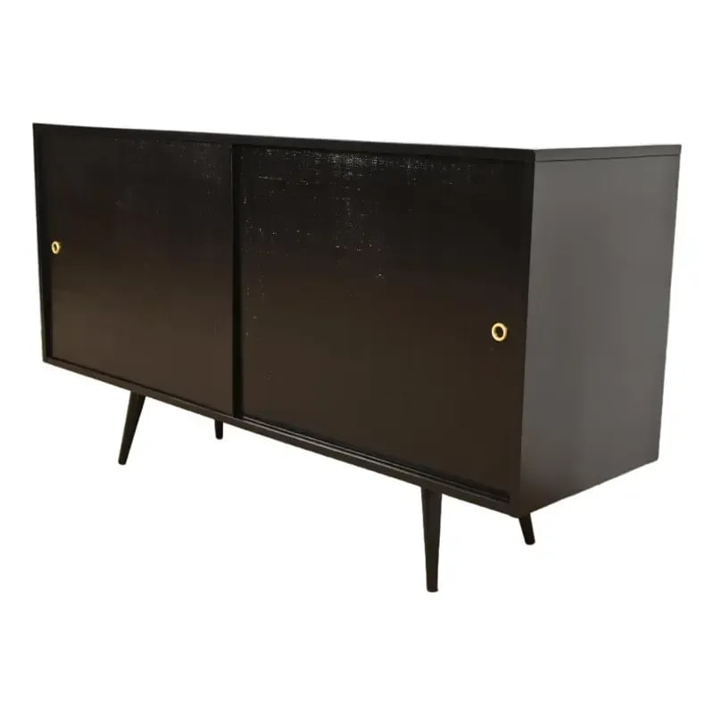 Paul McCobb Planner Group Mid-Century Modern Black Lacquered Sideboard Credenza, Newly Refinished: A gorgeous Mid-Century Modern sideboard, credenza, or bar cabinet By Paul McCobb for Winchendon Furniture, "Planner Group" USA, 1950s Black lacquered solid birch, with sliding grass cloth doors. Measu