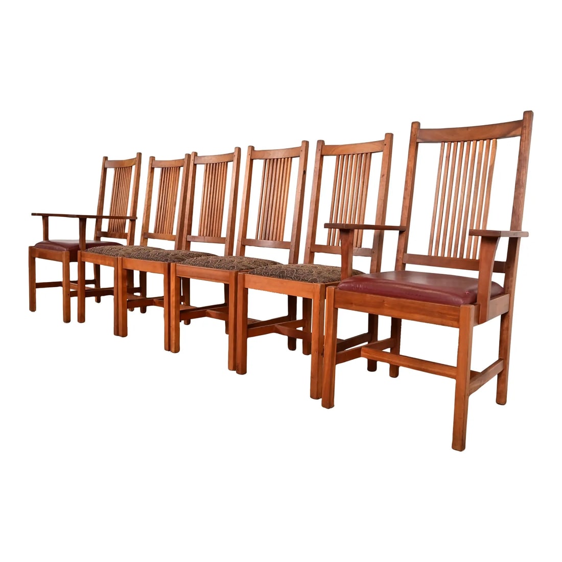 Stickley Mission Arts & Crafts Cherry Wood Spindle Back Dining Chairs, Set of Six: An exceptional set of six Mission or Arts & Crafts style spindle back dining chairs By L. & J.G. Stickley USA, 1994 Solid cherry wood frames, with upholstered seats. Measures: Side chairs - 17.5"W x 2