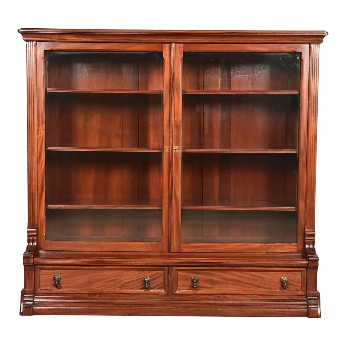 Herter Brothers Style Antique Eastlake Victorian Carved Mahogany Bookcase Cabinet, Circa 1880s: A gorgeous antique Eastlake Victorian bookcase cabinet In the manner of Herter Brothers USA, Circa 1880s Carved mahogany, with glass front doors, and original brass hardware. Interior shelves are adju