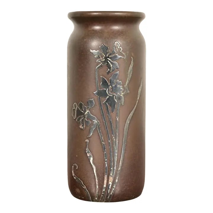 Heintz Arts & Crafts Sterling Silver on Bronze Vase With Floral Decoration: A beautiful Arts & Crafts period sterling silver on bronze cylinder vase with floral motif By Heintz Art Metal Shop USA, Early 20th Century Measures: 3.5"W x 3.5"D x 8.25"H. Good original vintage cond