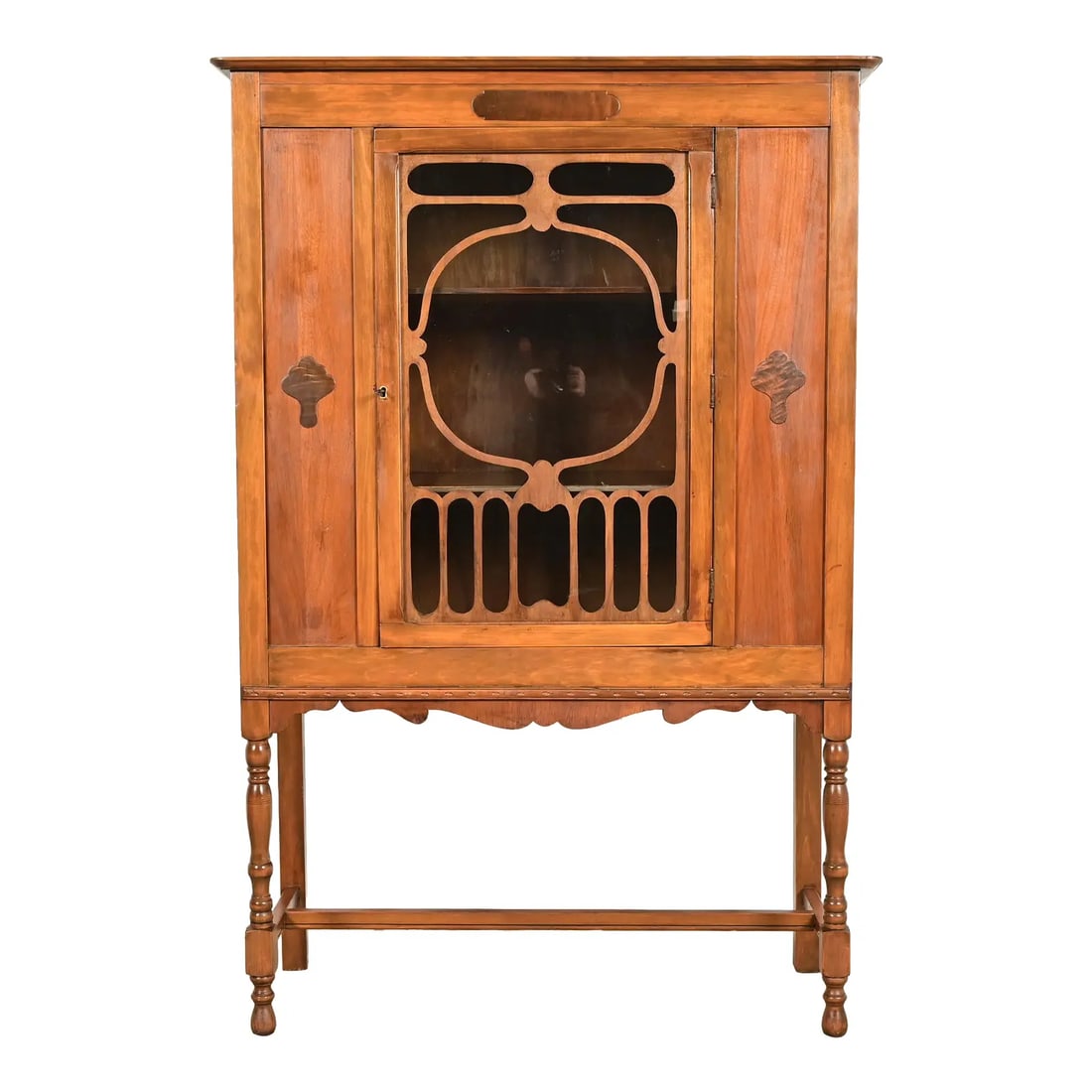 Berkey & Gay Style Antique English Jacobean Carved Walnut and Burl Wood Bookcase or Bar Cabinet: A gorgeous English Jacobean or Art Nouveau style bookcase, china hutch, or bar cabinet In the manner of Berkey & Gay USA, Circa 1920s Carved walnut, with burl wood inlay, and mullioned glass front doo