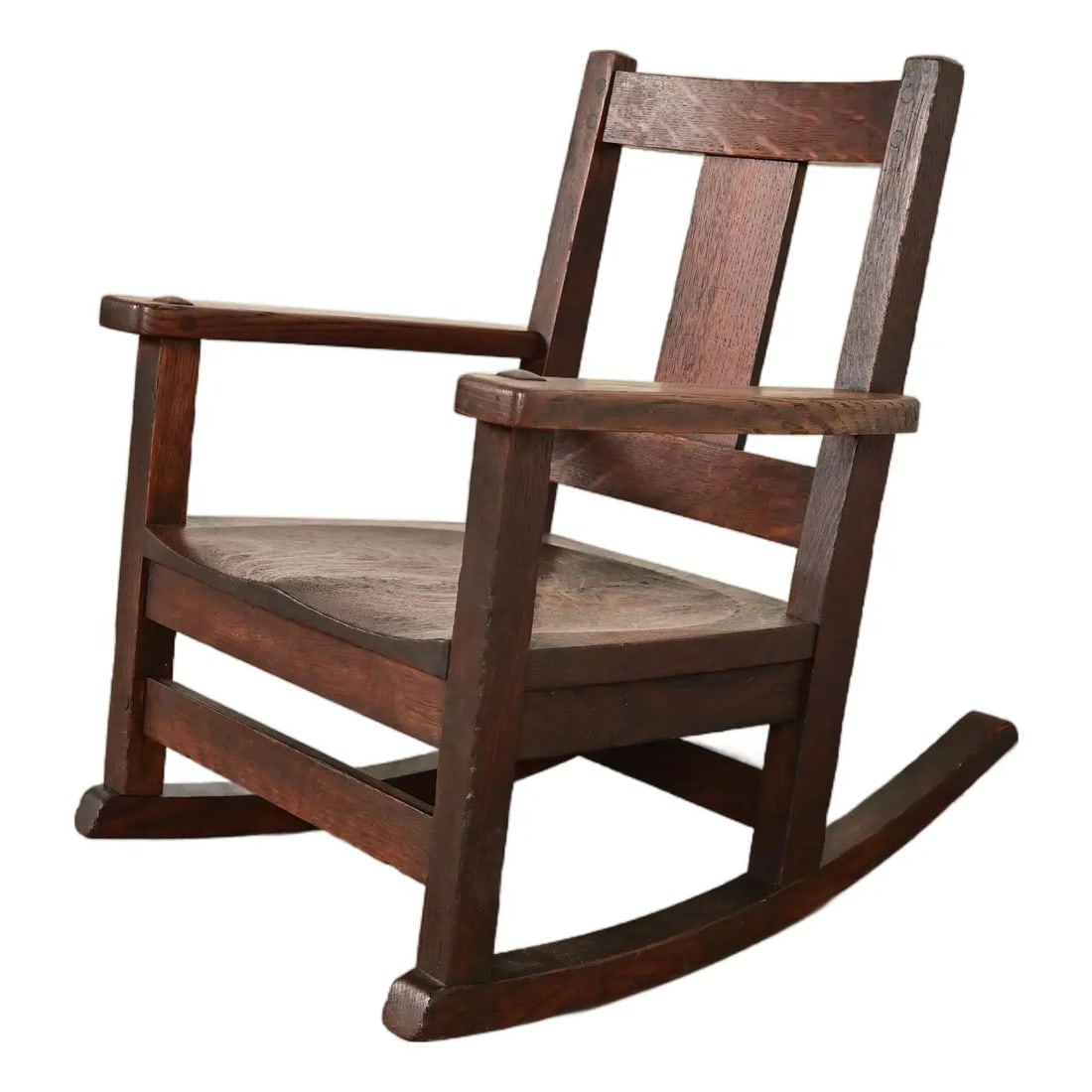 Limbert Antique Mission Oak Arts & Crafts Child's Rocking Chair, Circa 1910: A rare and exceptional antique Mission or Arts & Crafts period child's rocking chair By Charles P. Limbert Co. USA, Circa 1910 Measures: 17.25"W x 20"D x 20.5"H. Seat height: 8.75". Arm height: 14". V
