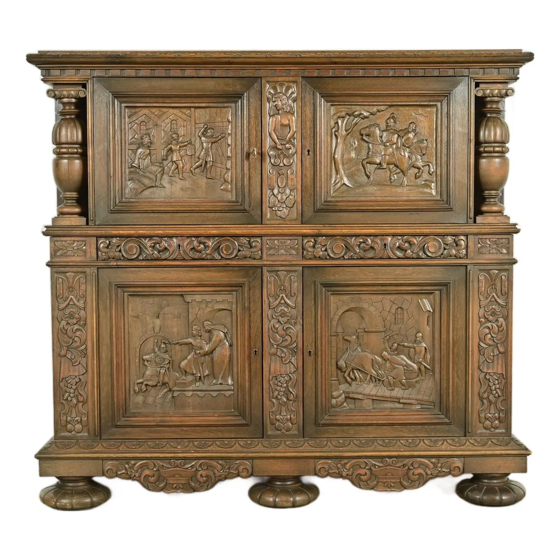Antique Danish Renaissance Revival Carved Oak Bar Cabinet, Circa 1890s: An exceptional antique Victorian or Renaissance Revival ornate carved oak cupboard or bar cabinet In the manner of R.J. Horner & Co. Denmark, Circa 1890s Oak, with ornate carvings depicting the life a