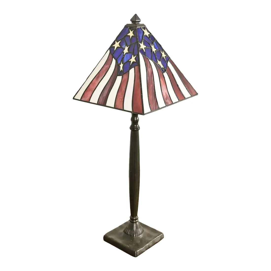 Arts & Crafts Table Lamp With American Flag Stained Glass Shade: A gorgeous Arts & Crafts style table lamp USA, Circa Late 20th Century Patinated metal base, with American Flag stained glass shade. Measures: 10"W x 10"D x 27.25"H. Very good original vintage conditi
