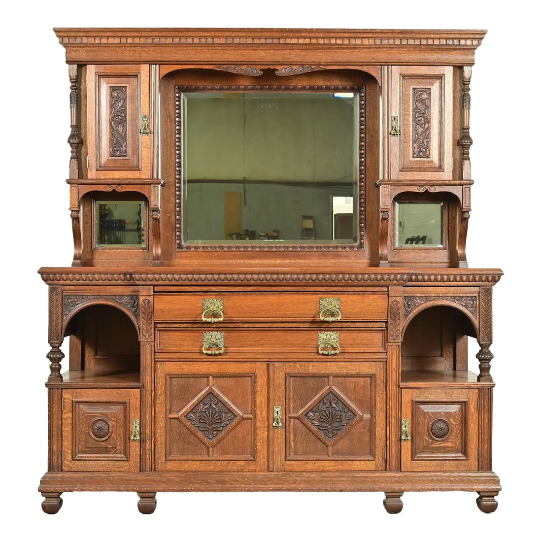 Herter Brothers Style Antique English Victorian Carved Oak Mirrored Back Bar or Sideboard: A gorgeous antique English Victorian or Aesthetic Movement sideboard, buffet server, or bar cabinet In the manner of Herter Brothers By Collinge & Co. Ltd. England, Late 19th Century Beautiful quarter