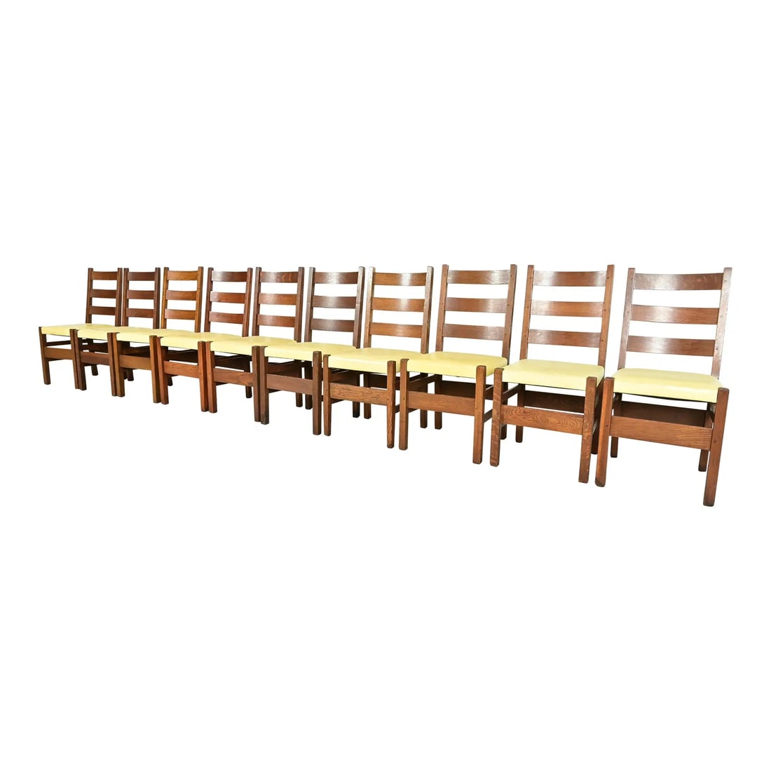 Gustav Stickley Antique Mission Oak Arts & Crafts Ladder Back Dining Chairs, Set of Ten: An exceptional set of ten antique Mission or Arts & Crafts period ladder back dining chairs By Gustav Stickley USA, Early 20th Century Solid quarter sawn oak frames, with yellow leather upholstered se