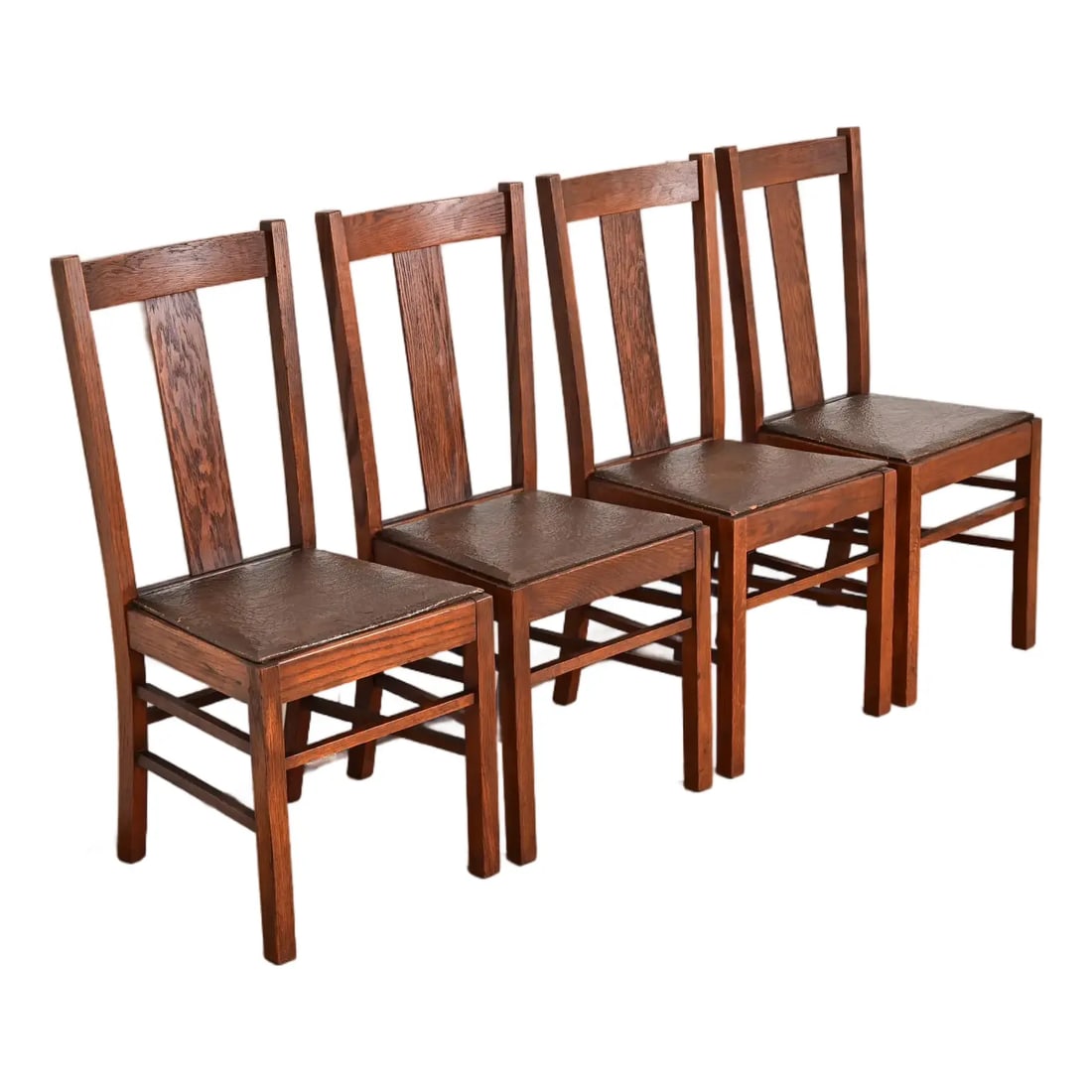 Limbert Style Antique Mission Oak Arts & Crafts T-Back Dining Chairs, Set of Four: A gorgeous set of four Mission or Arts & Crafts period T-back side chairs or dining chairs In the manner of Charles P. Limbert Co. By Cleveland Chair Co. USA, Circa 1900 Solid quarter sawn oak, with l