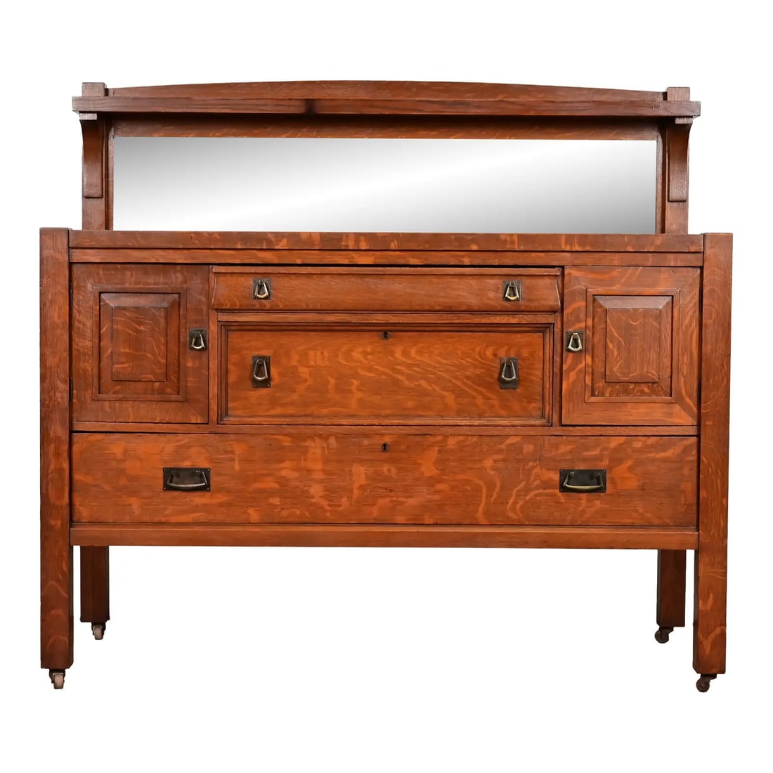 Stickley Brothers Style Antique Mission Oak Arts & Crafts Sideboard or Bar Cabinet, Circa 1900: A gorgeous antique Mission or Arts & Crafts period sideboard, buffet server, or bar cabinet In the manner of Stickley Brothers By The Jake Tennenbaum Co. USA, Circa 1900 Quarter sawn oak, with mirrore