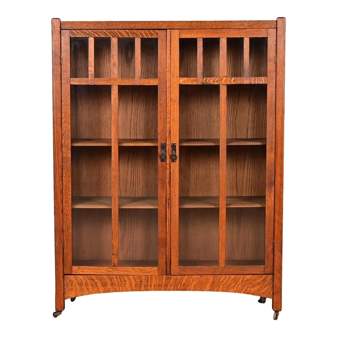 Limbert Style Mission Oak Arts & Crafts Glass Front Double Bookcase Cabinet, Circa 1900: A beautiful Mission or Arts & Crafts period glass front double bookcase cabinet In the manner of Charles P. Limbert Co. USA, Circa 1900 Gorgeous quarter sawn oak, with mullioned glass front doors and 