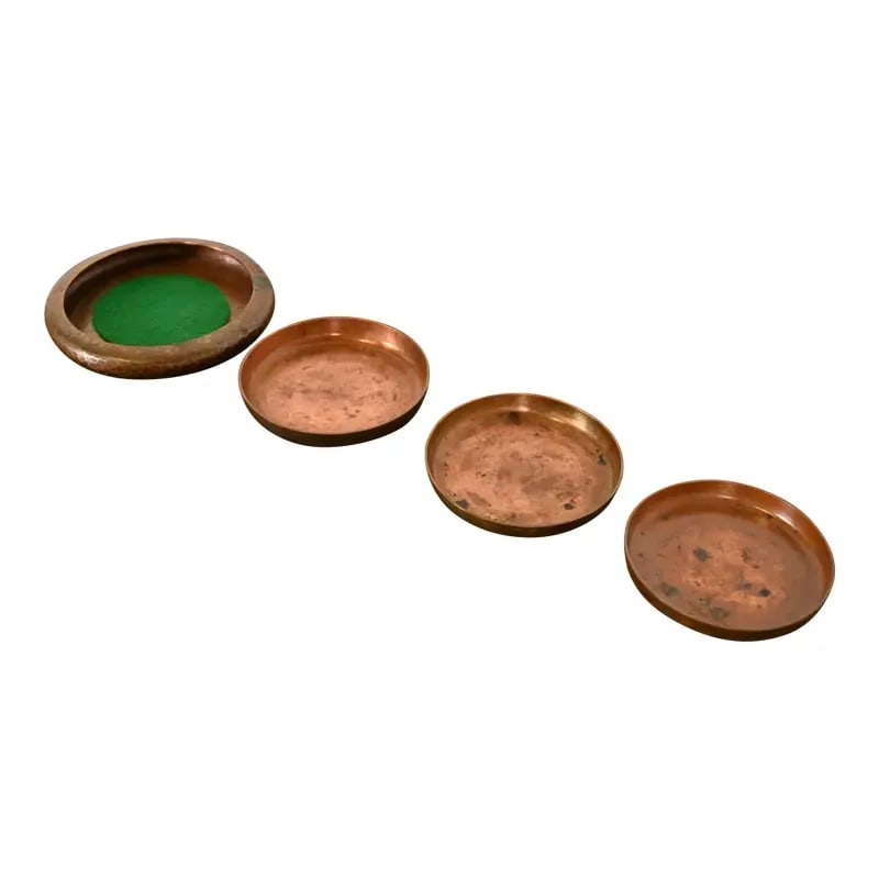 Roycroft Arts & Crafts Hammered Copper Coasters, Set of Four: A gorgeous set of four Arts & Crafts period hammered copper coasters or trinket dishes By Roycroft (signed with impressed orb and cross mark) USA, Early 20th Century Measures: A- 4"W x 4"D x 0.5"H. B-