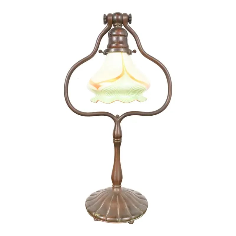 Tiffany Studios New York Bronze Harp Desk Lamp With Pulled Feather Favrile Glass Shade: A rare and exceptional antique Arts & Crafts or Art Deco period bronze harp desk lamp or table lamp By Tiffany Studios (signed to the underside of base) New York, USA, Early 20th Century Patinated bro